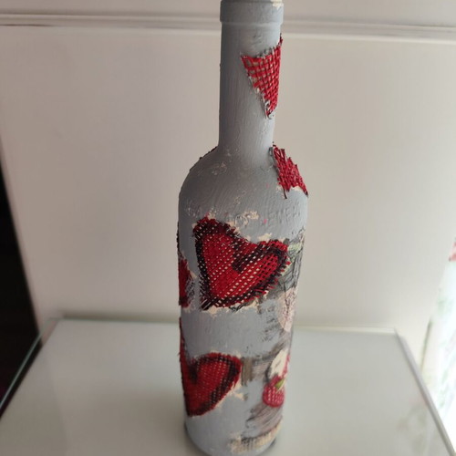 Glass bottle new with decoupage decoration and red hearts