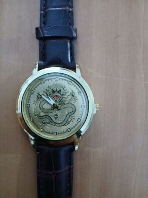 Watch new with design, brown strap and gold case