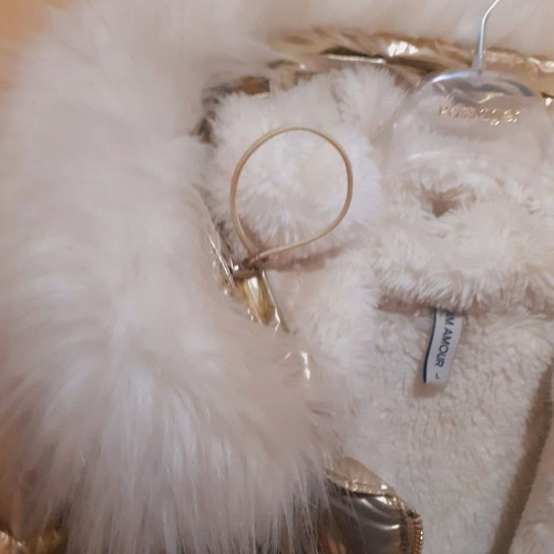 Short gold jacket with white fur and hood