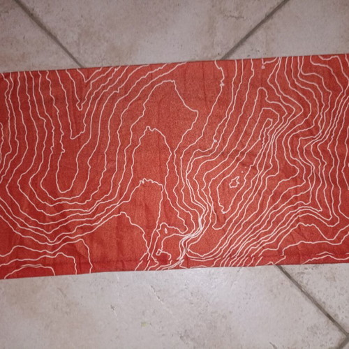 Pentagon Multifunctional Neck Buff like new, terracotta topographic design