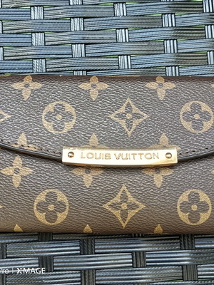 Louis Vuitton wallet used, authentic with visible marks inside