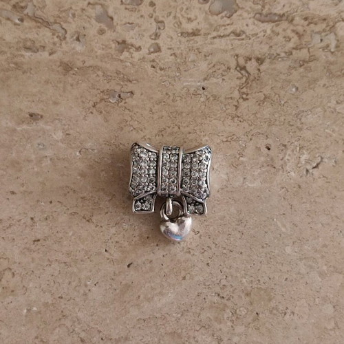 Pandora charm silver 925 like new with bow and heart zirconia