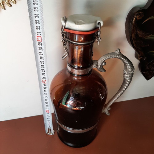 German vintage beer bottle growler with metal handle