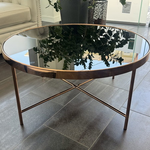 Round coffee table with glass top and metal frame