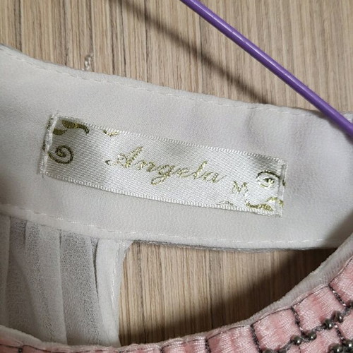 Women's top with sequins used, white with pink embroidery, size M