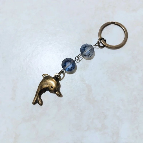 Keychain with dolphin keyholder, like new, gold and blue