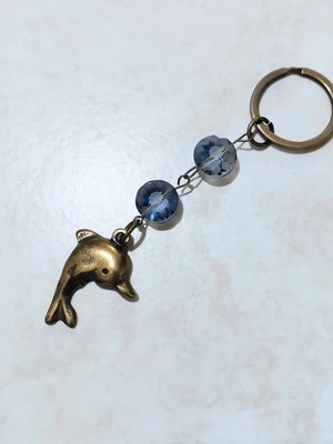 Keychain with dolphin keyholder, like new, gold and blue