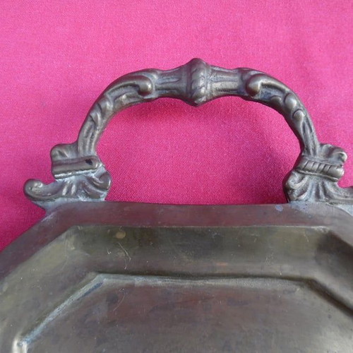 Handmade brass tray used with carved handles