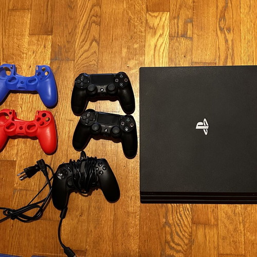 PlayStation 4 Pro 1TB like new with 3 controllers and 7 games