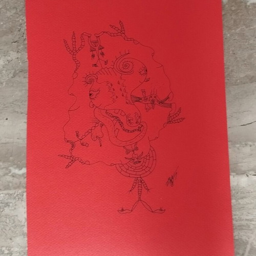 Handmade artwork "Is Beauty Dark?" with black ink on red cardboard