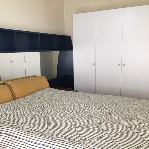 Modern bedroom set used with double bed, mirror, shelves, 2 nightstands, mattress, pillows, and reversible duvet