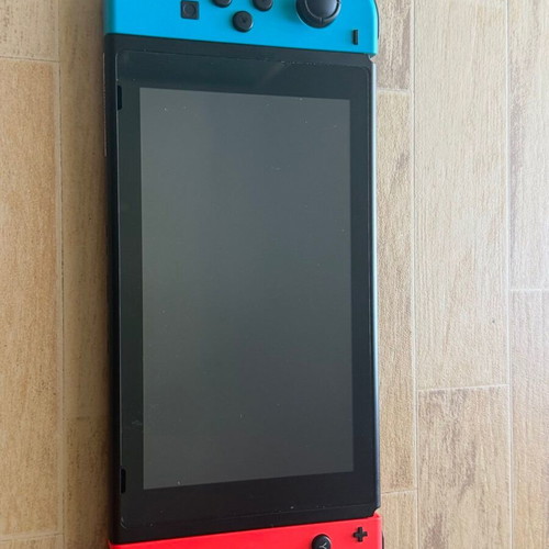 Nintendo Switch console bundle with 4 games and accessories