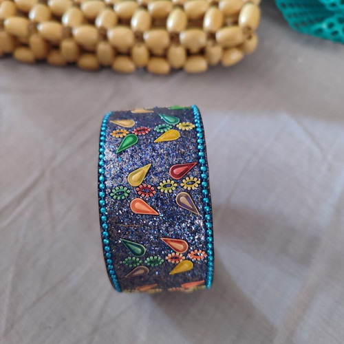Ethnic bracelet made of brass with intricate colorful designs like new