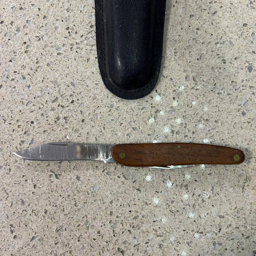 Folding knife used from 1980s with sheath