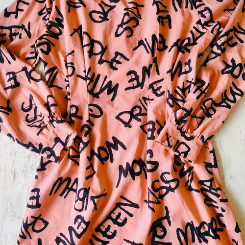 Shirt dress or tunic new, peach color with black graffiti