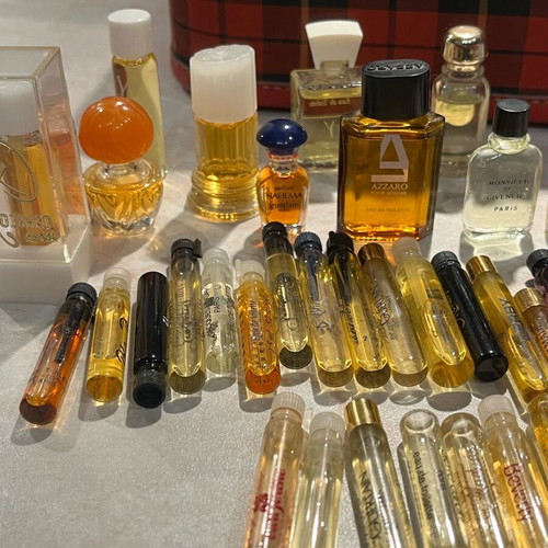 Filled vintage women's perfume vials from 1960-1990