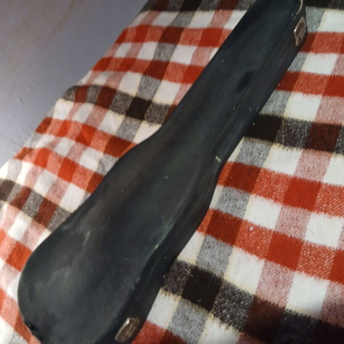 Cremona violin used, male with broken bow and strings