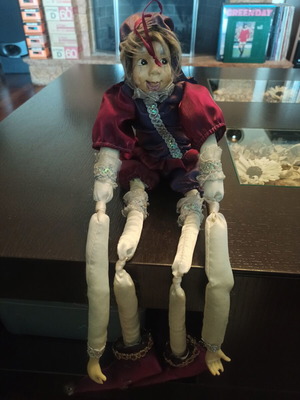 Wind-up Pierrot Harlequin doll used with music
