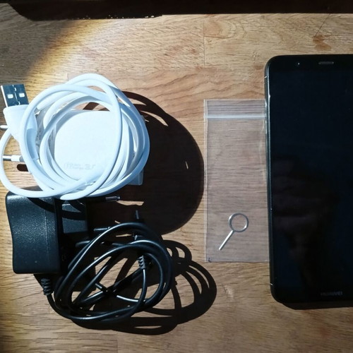 Huawei smartphone 2018 model, black, with 2 extra chargers