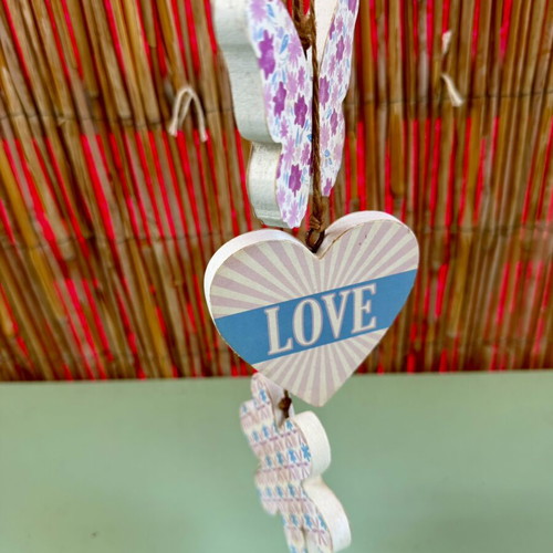 Handmade hanging decoration with butterfly, heart and flower wooden motifs
