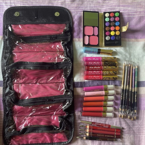 Cosmetics set new with 11 lipsticks, 5 lip pencils, 7 double eye pencils, eyeliner, mini eyeshadow palette, blush, lip balm, and gift pouch