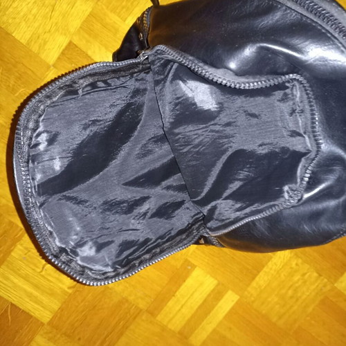 Backpack black leather type used with multiple pockets