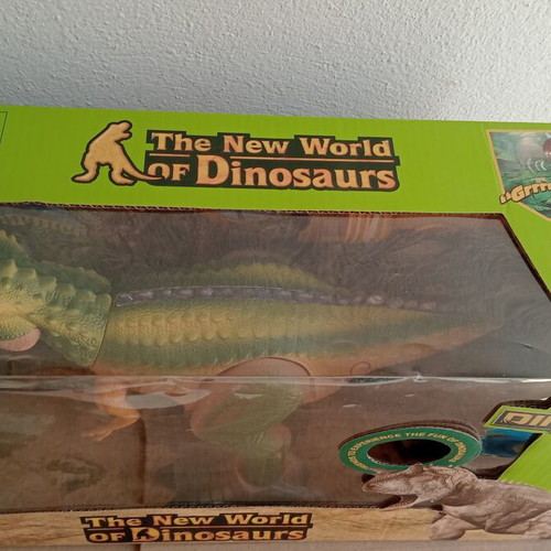 Dinosaur toy like new, in original box with minor wear
