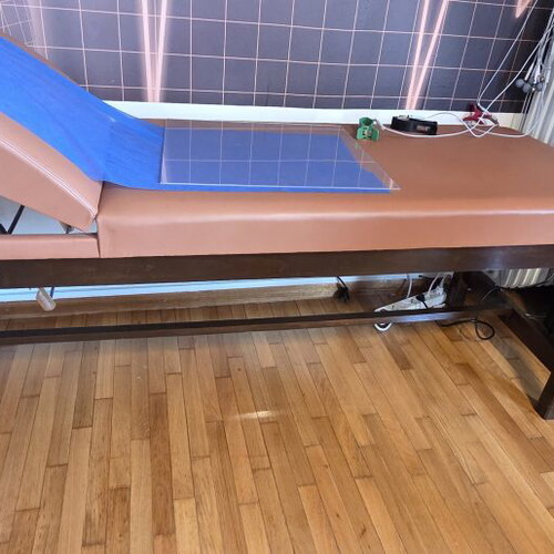 Examination bed, brown, wooden