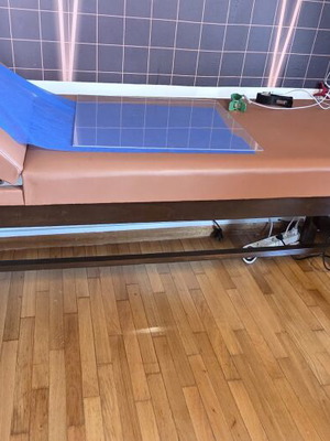 Examination bed, brown, wooden