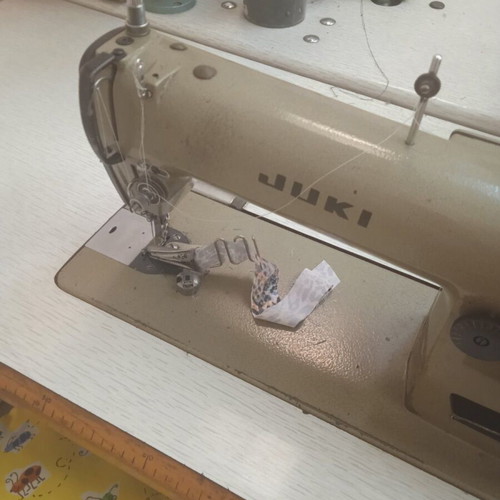 Industrial sewing machines used, including Treasure button machine and cutters