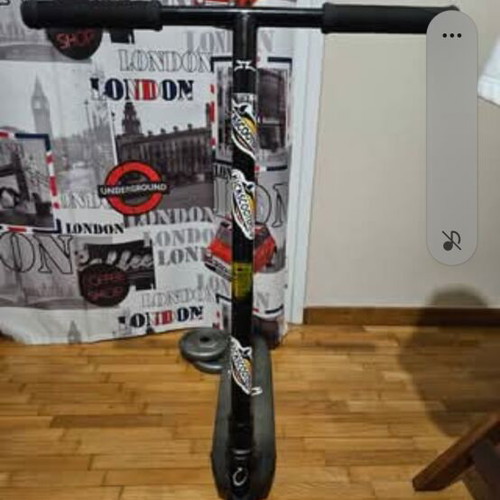 Scooter used for tricks with Ethic Vulcain 530 deck