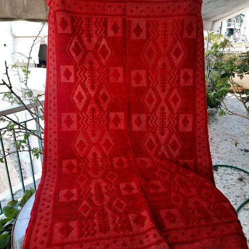 Handmade wool blanket used in red color