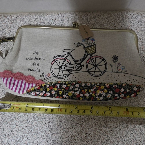 Canvas wrist bag with clip and 2 pockets like new, multicolor