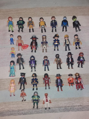 Playmobil figures and props used with suitcases
