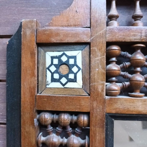 Vintage bijouterie mirror with wooden ornate frame