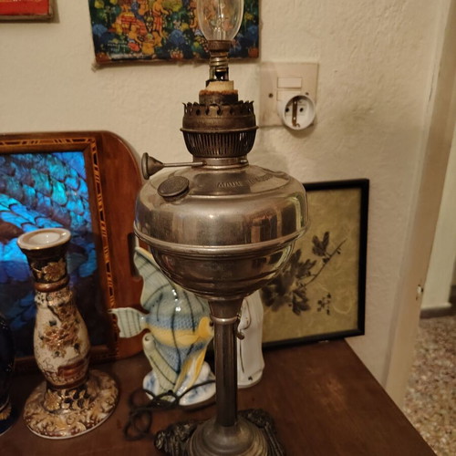 Lamp converted into adjustable light fixture