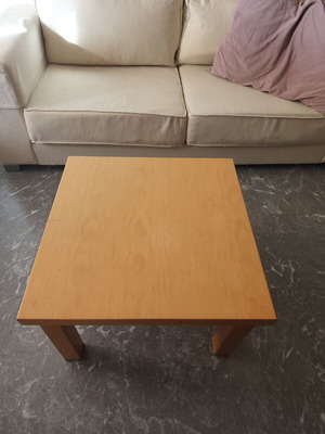 Wooden square coffee table used with minor surface wear