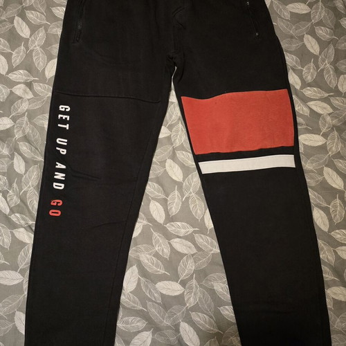 Orchestra boys' sweatpants like new, size 14, black and red