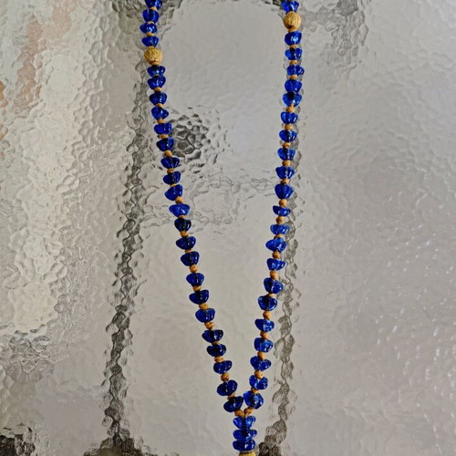 Tabletop komboloi with blue and gold glass beads