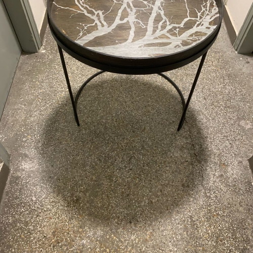 Decorative coffee table used with metal base and wooden top frame