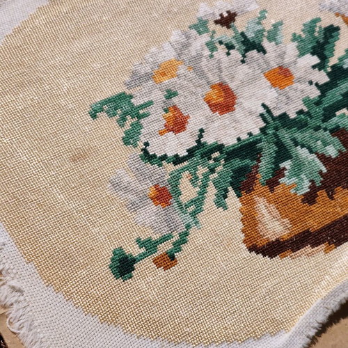 Vintage needlepoint with embroidered daisy bouquet used