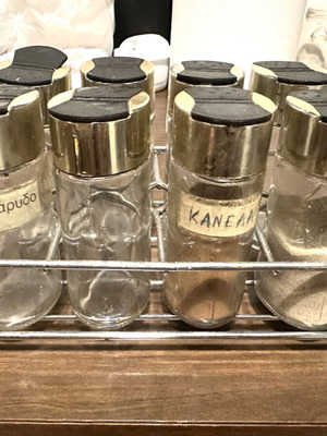 Vintage spice set with metal rack and 8 glass jars used