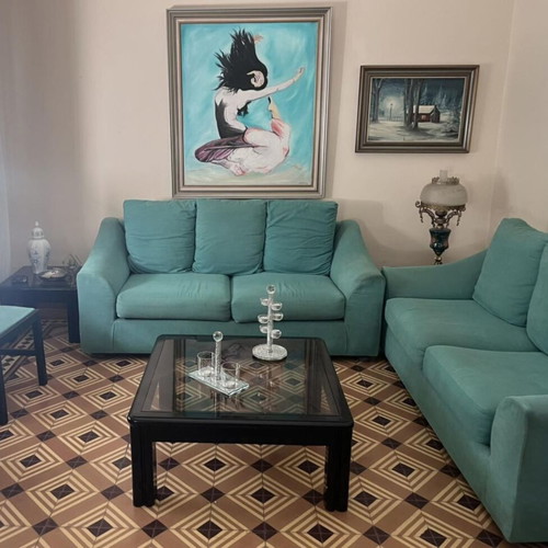 Living room set with 2 fabric sofas and 3 coffee tables used