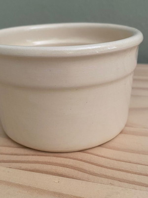 Small beige ceramic bowl used
