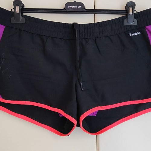 Reebok women's PlayDry ZigTech running shorts used, black and purple, size M