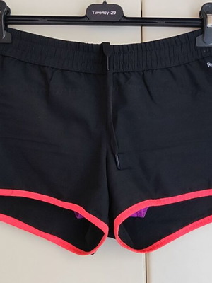 Reebok women's PlayDry ZigTech running shorts used, black and purple, size M
