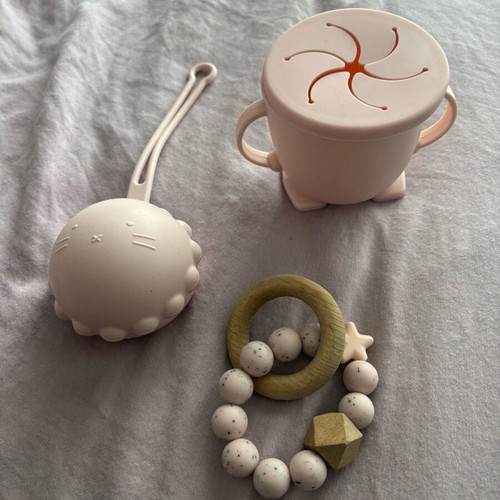 Baby silicone teething set, pacifier holder and training cup used