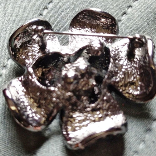 Vintage brooch with black and silver rhinestones, flower shape, like new