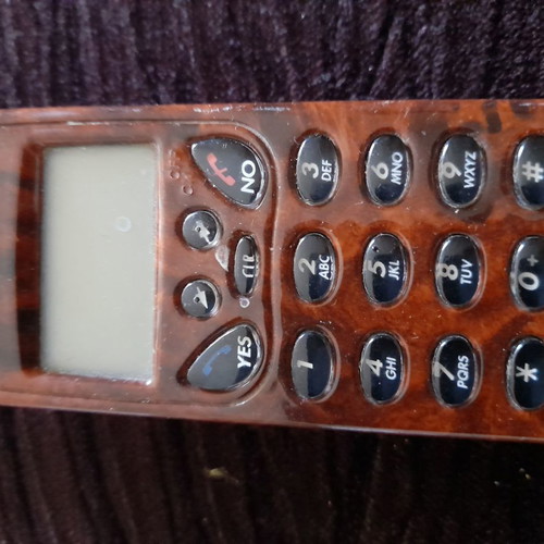 Ericsson antique phone used with wood-style finish