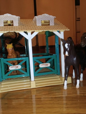 Stable with horses toy used, one trimmed mane